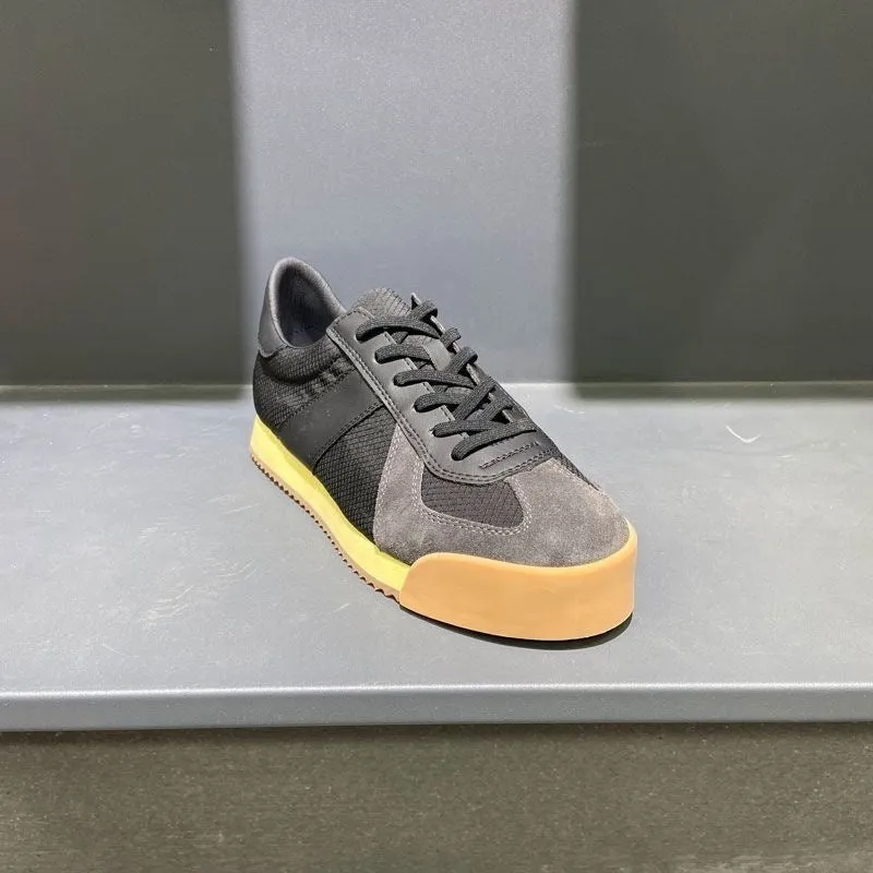 Men's grey suede and mesh sports shoe with a raised heel and herringbone pattern on the toe.