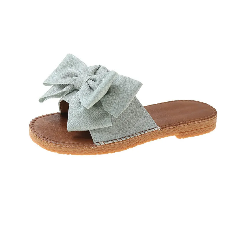 Women's slip-on cloth sandals with bow detail in beige, light green, and pink colours