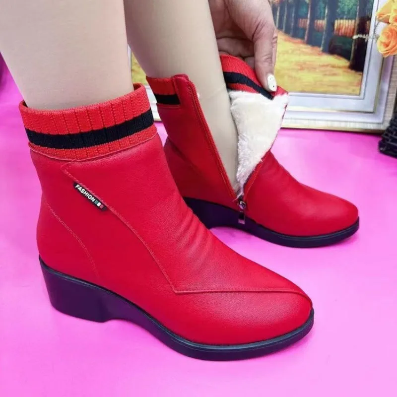 Women's soft leather ankle boots with mid heel, side zipper, and square heel in black