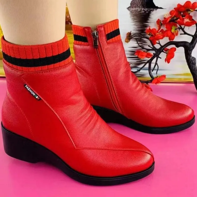 Women's soft leather ankle boots with mid heel, side zipper, and square heel in black