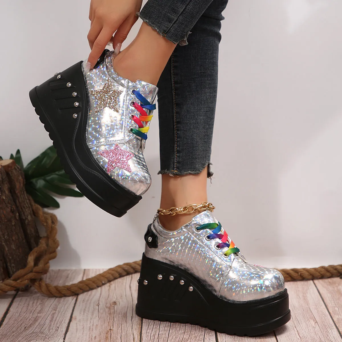 White punk platform shoes with shiny PU upper, rivet detailing, round toe, and thick sole