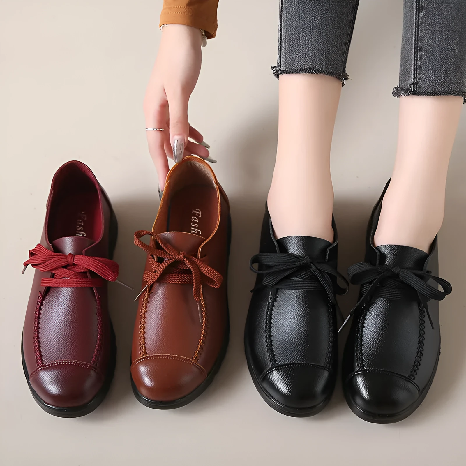 Women's black round toe flat work shoes with front lacing and soft anti-slip polyurethane sole