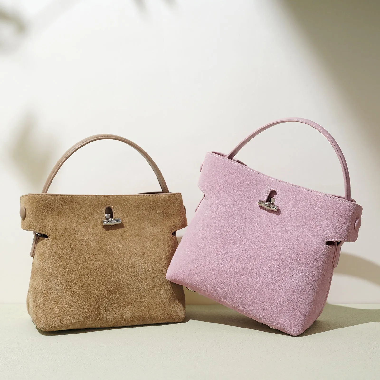 Women's mini Korean-style simple messenger bag in two-layer matte cowhide, bucket shape with lock opening, internal compartments