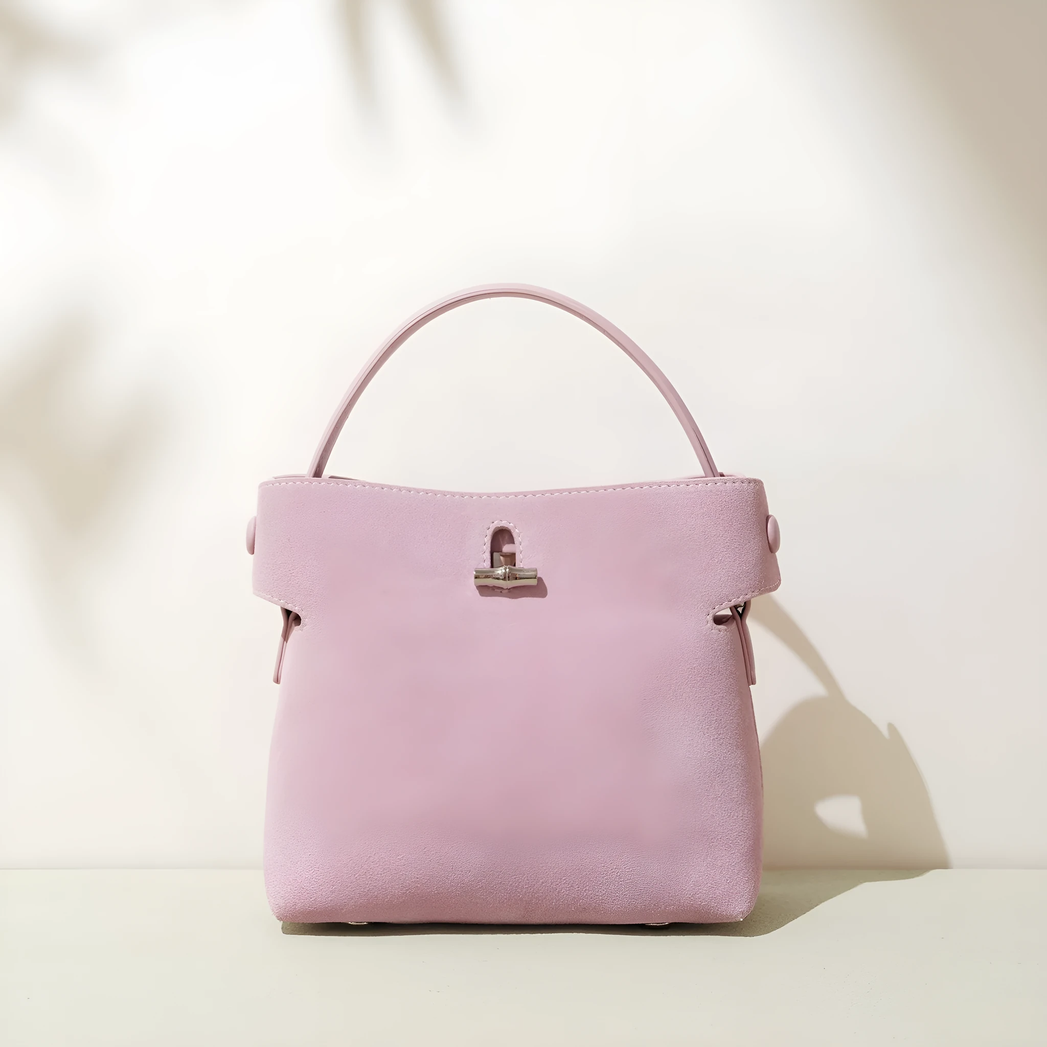 Women's mini Korean-style simple messenger bag in two-layer matte cowhide, bucket shape with lock opening, internal compartments