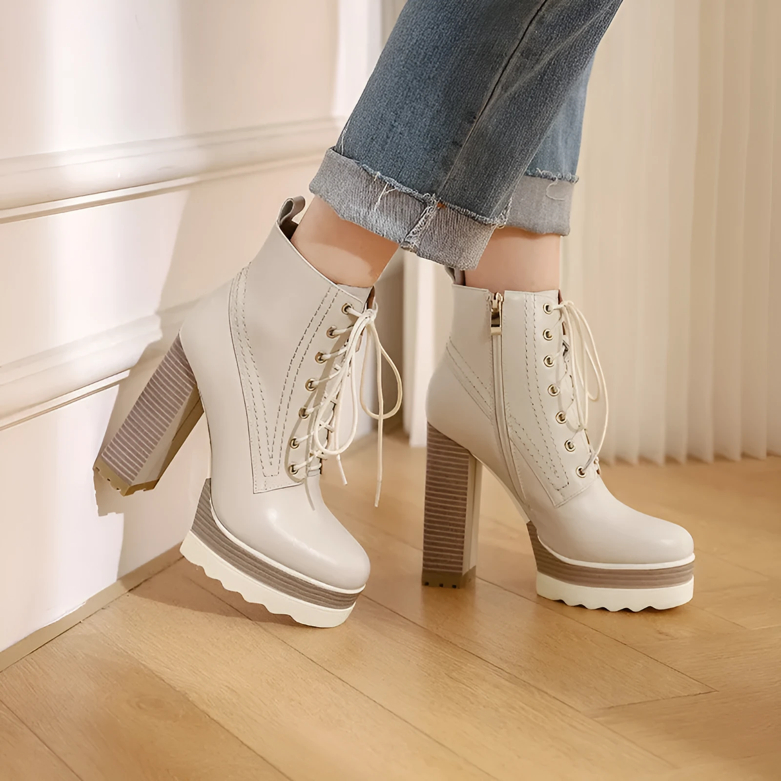 Women's black chunky heel waterproof platform ankle boots with side zip on a white background