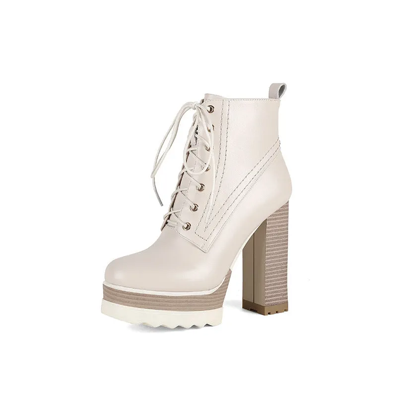 Women's black chunky heel waterproof platform ankle boots with side zip on a white background
