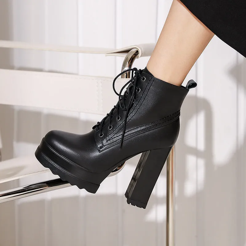 Women's black chunky heel waterproof platform ankle boots with side zip on a white background