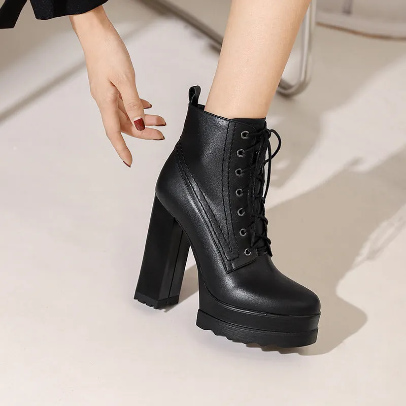Women's black chunky heel waterproof platform ankle boots with side zip on a white background