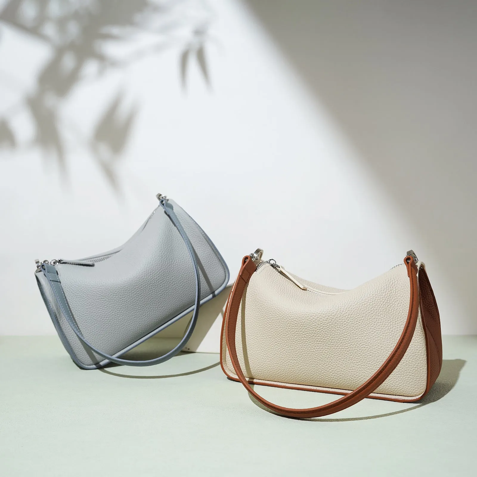 Women's first layer cowhide crossbody bag in pillow shape with double strap 23cm length milkshake white and brown