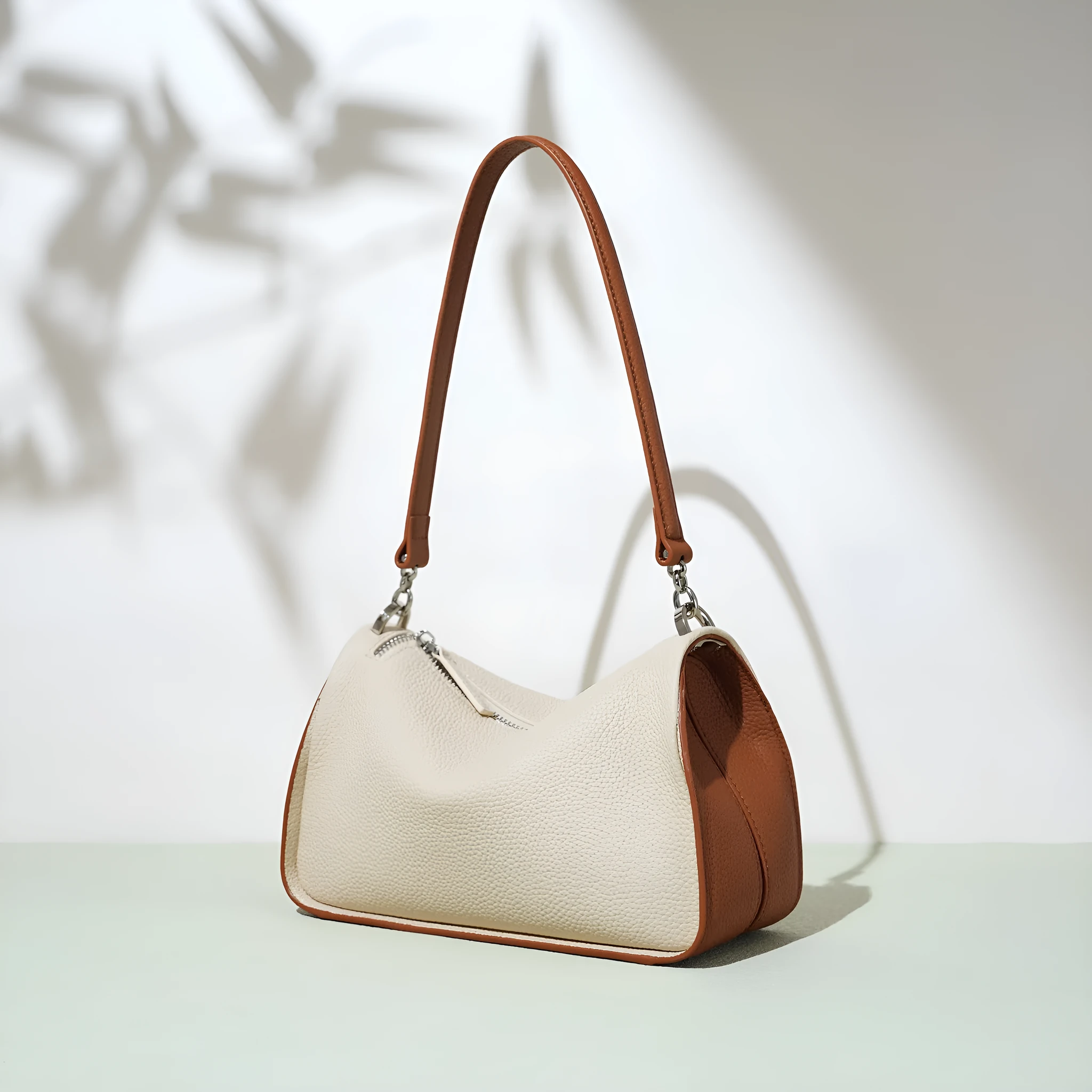 Women's first layer cowhide crossbody bag in pillow shape with double strap 23cm length milkshake white and brown
