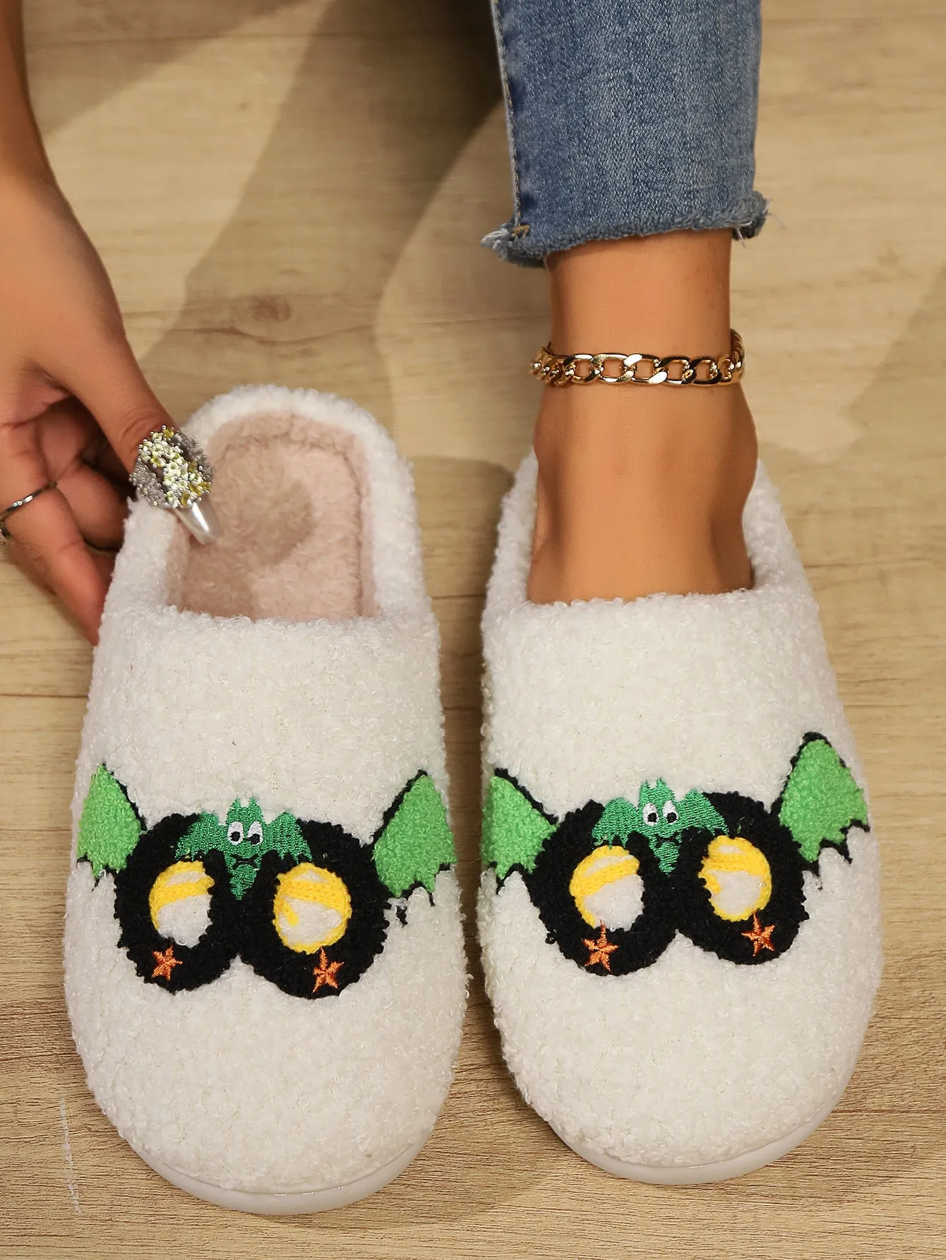 Women's indoor plush thermal cotton slippers with linen upper, non-slip sole, colour Mask Black, on a light indoor floor