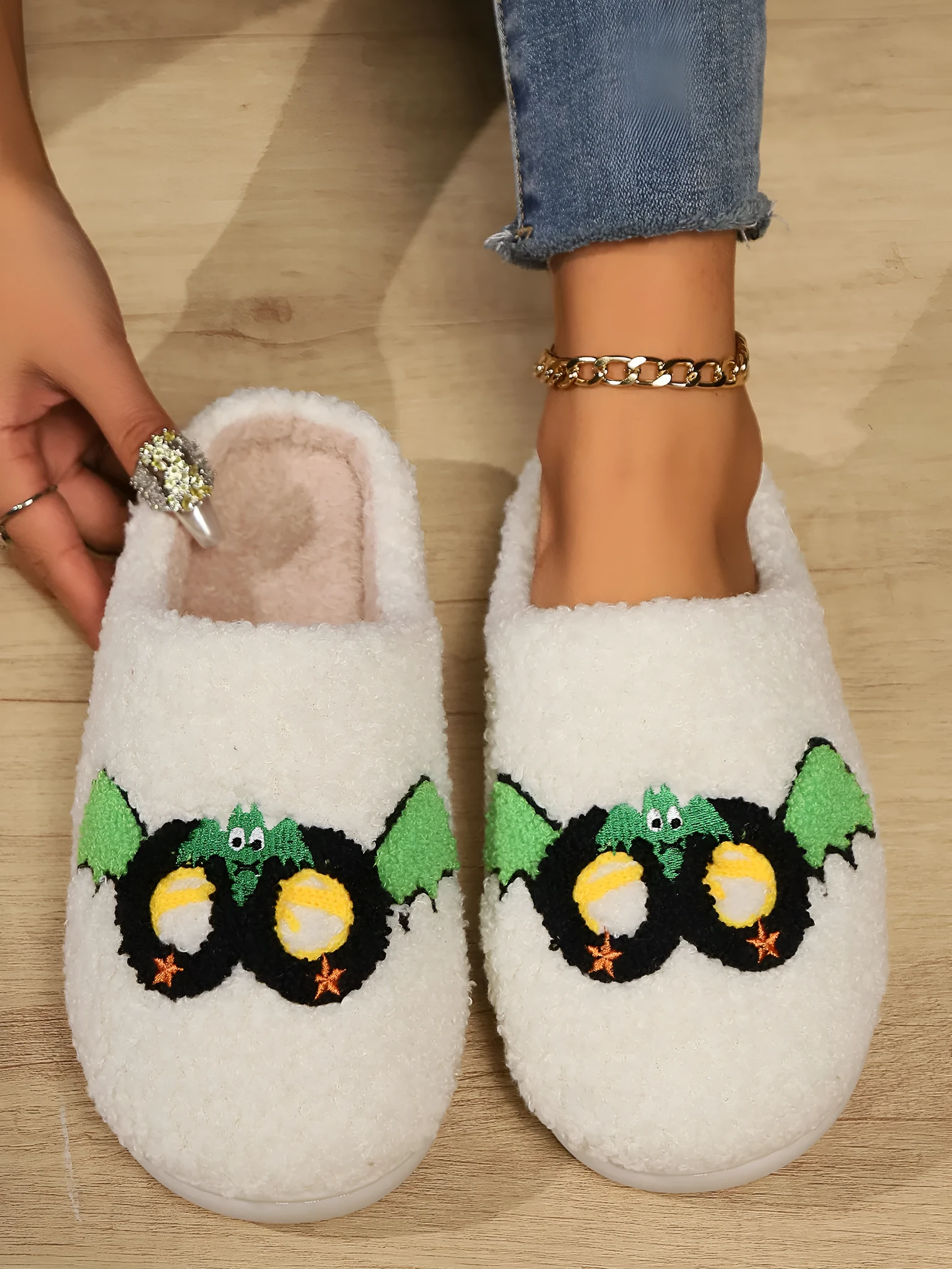 Women's indoor plush thermal cotton slippers with linen upper, non-slip sole, colour Mask Black, on a light indoor floor