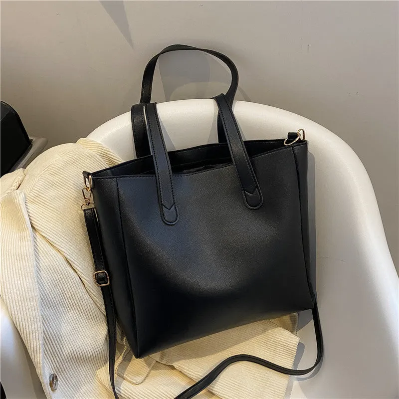 Single shoulder crossbody bag in horizontal square shape with PU exterior, available in black, brown, white, and yellow colourways