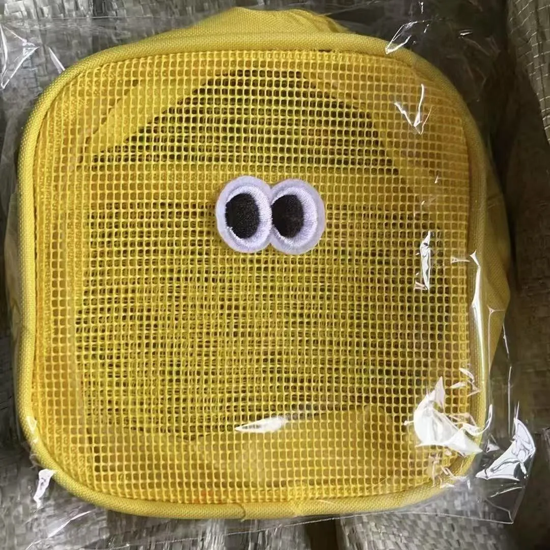 Stereo large capacity mesh makeup wash bag in cube shape, polyester, with zip closure, on a table