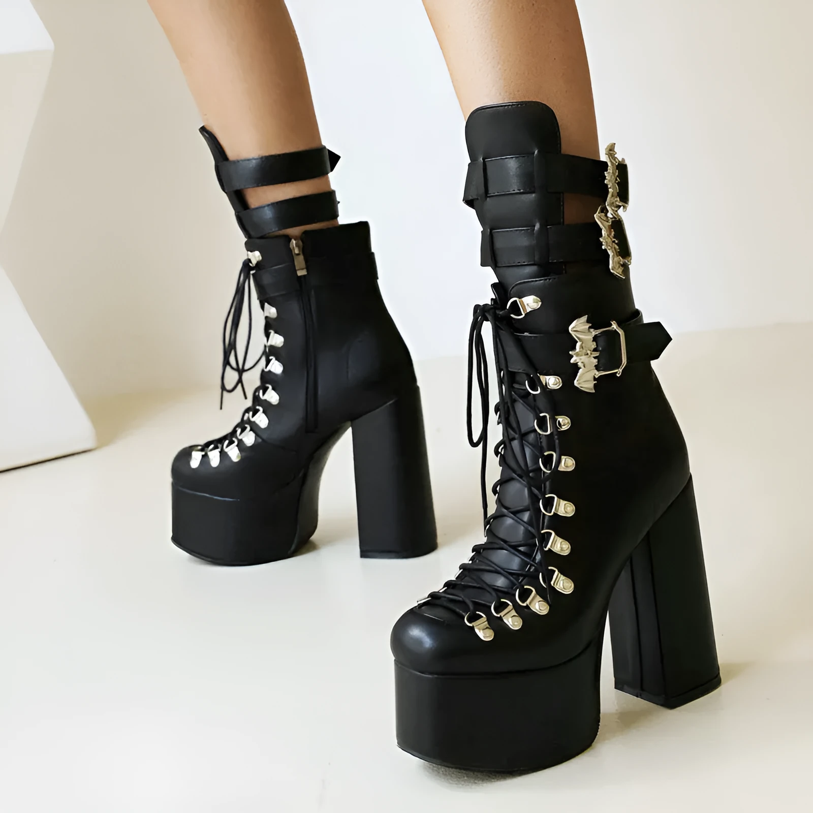 Chunky high-heel platform thigh-high boots in black patent leather with front lacing and block heel