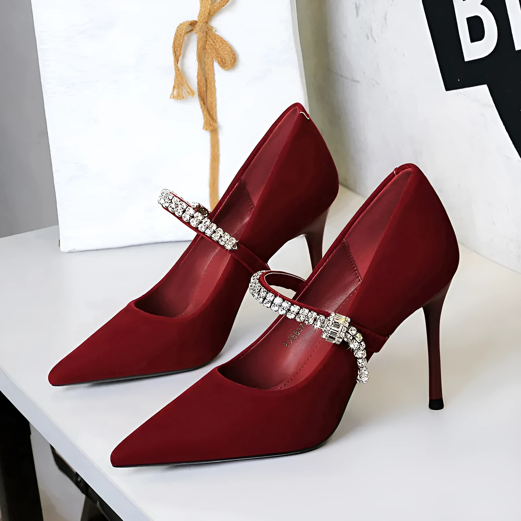 Pointed toe suede stiletto heels with rhinestone strap in black, shallow vamp design