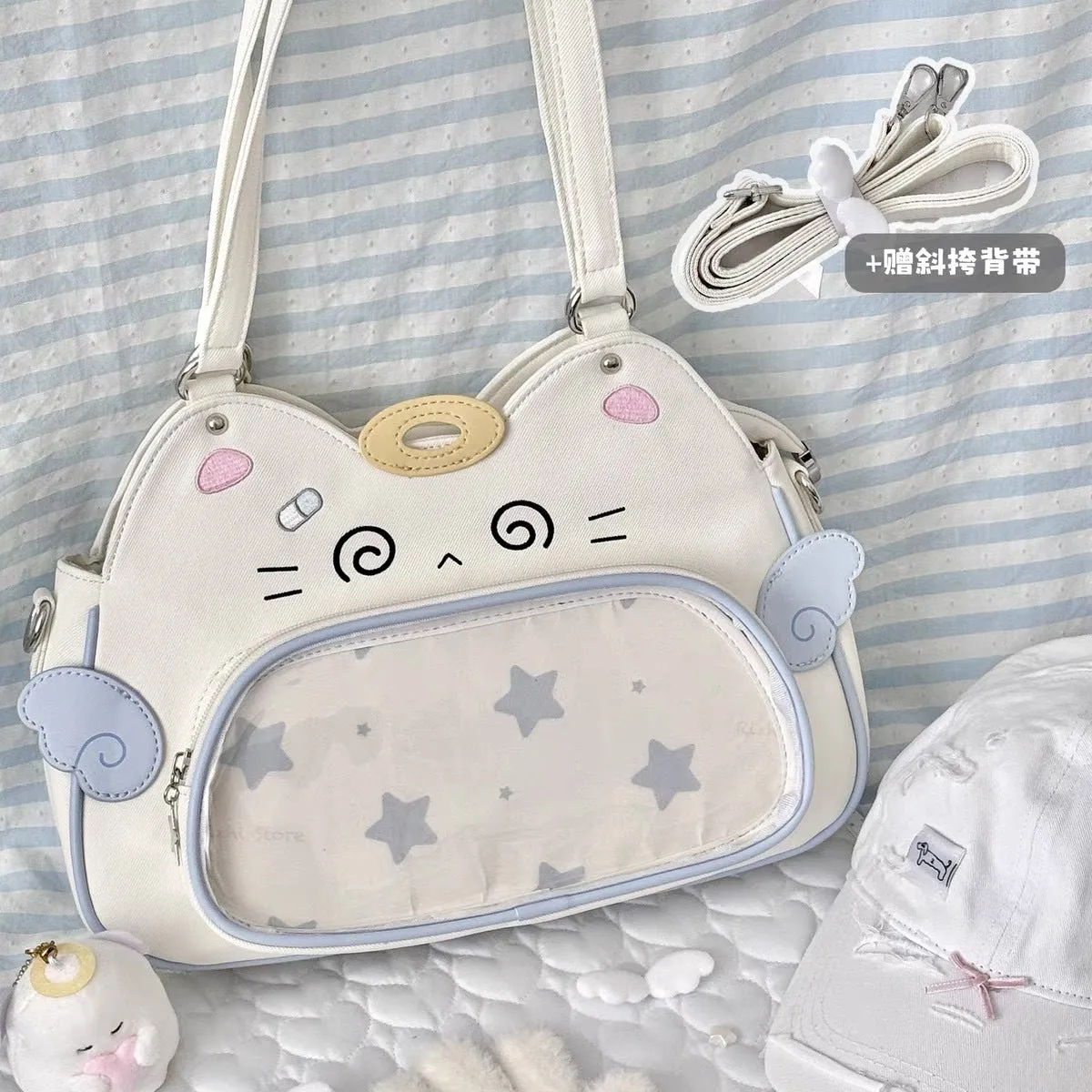 Horizontal cartoon owl pin PU crossbody bag in black, side view showing stitching and single strap