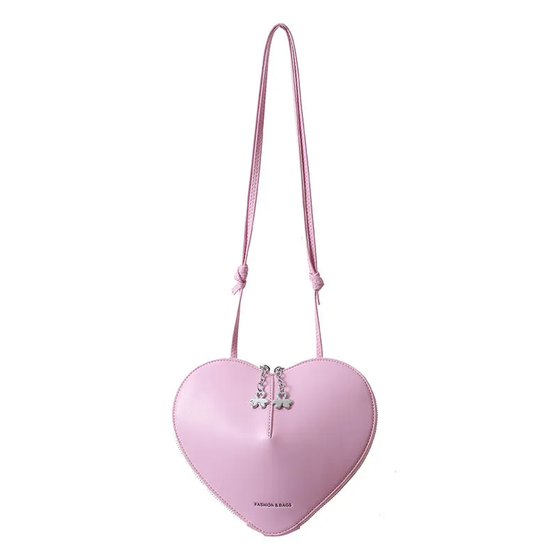 Women's PU leather heart shape crossbody bag in milky white with sewing line design and single shoulder strap