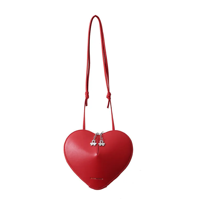 Women's PU leather heart shape crossbody bag in milky white with sewing line design and single shoulder strap