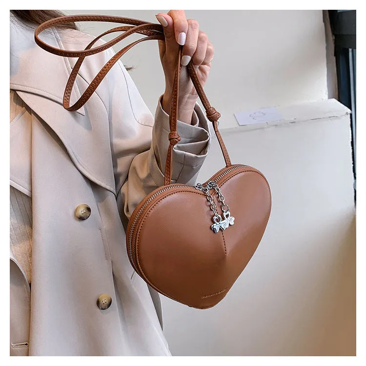 Women's PU leather heart shape crossbody bag in milky white with sewing line design and single shoulder strap