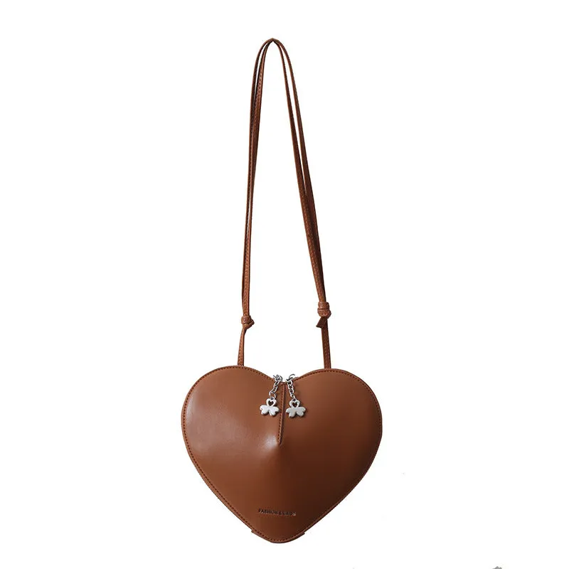 Women's PU leather heart shape crossbody bag in milky white with sewing line design and single shoulder strap