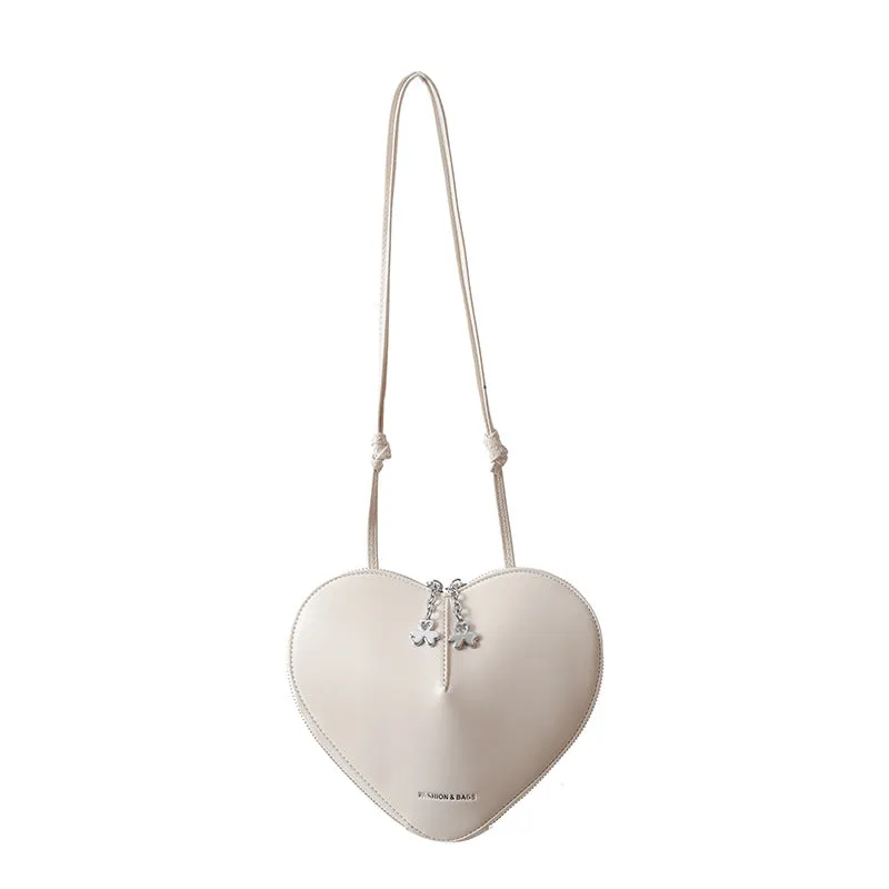 Women's PU leather heart shape crossbody bag in milky white with sewing line design and single shoulder strap