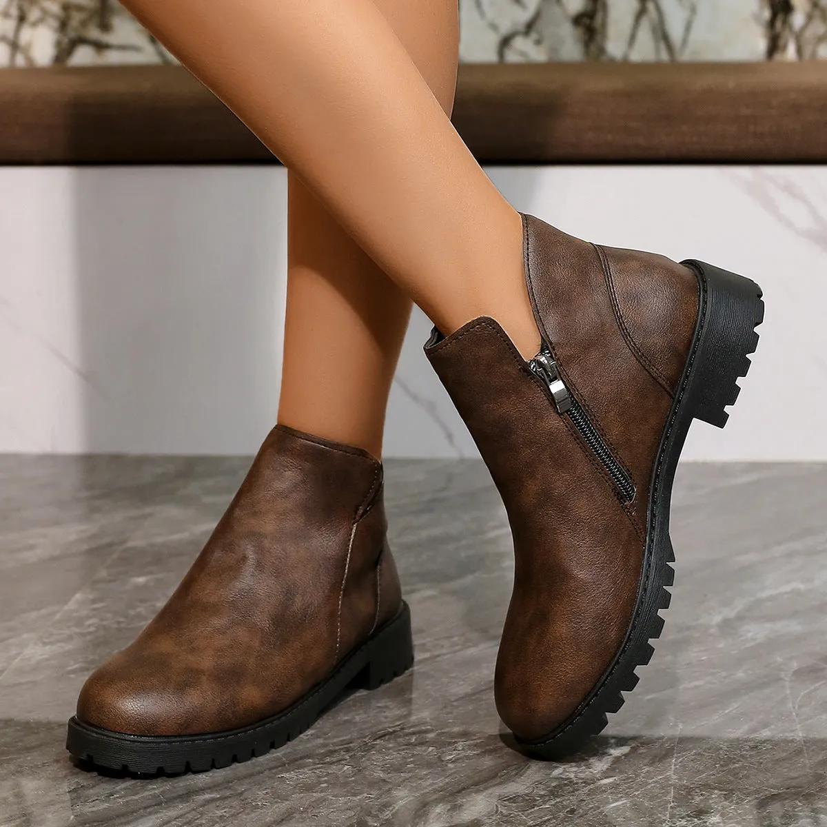 Women's casual low-cut ankle boots in dark brown with chunky heel, side zipper, and stitching on synthetic PU upper
