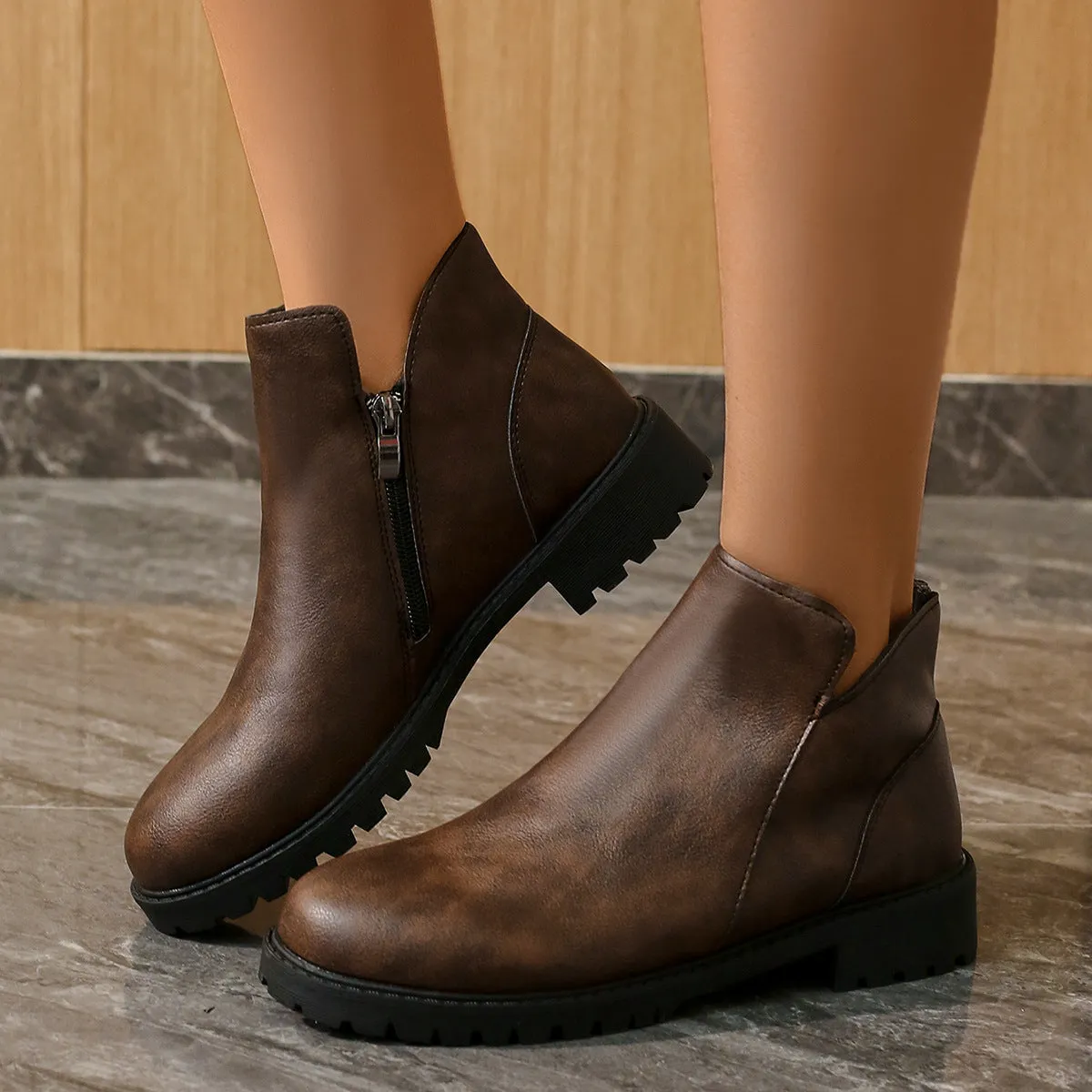 Women's casual low-cut ankle boots in dark brown with chunky heel, side zipper, and stitching on synthetic PU upper