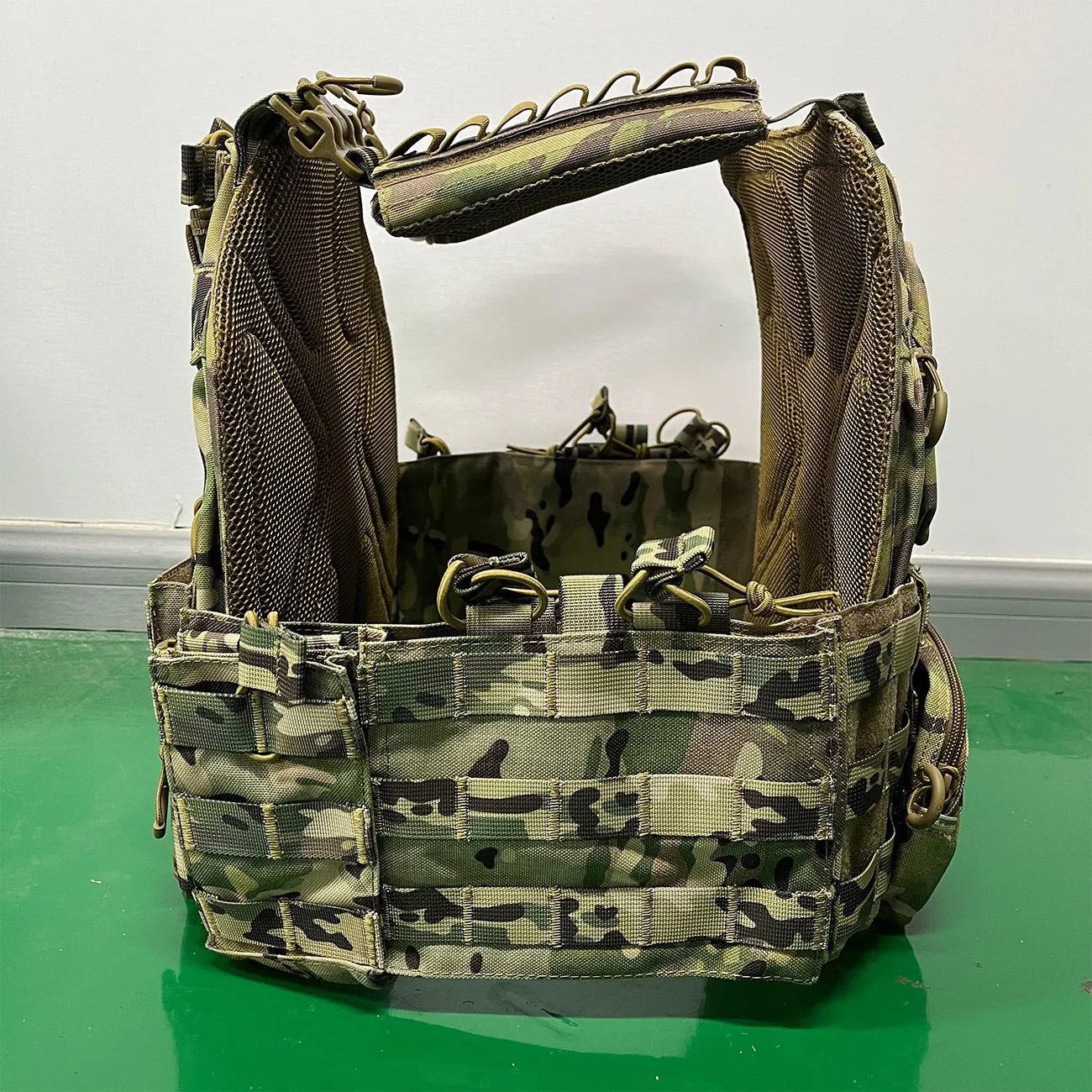 Solid colour Oxford cloth tactical vest in army green shown front view for outdoor use