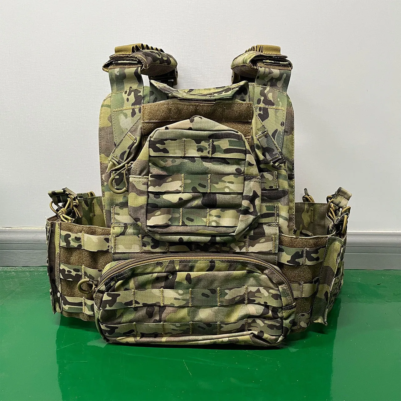 Solid colour Oxford cloth tactical vest in army green shown front view for outdoor use