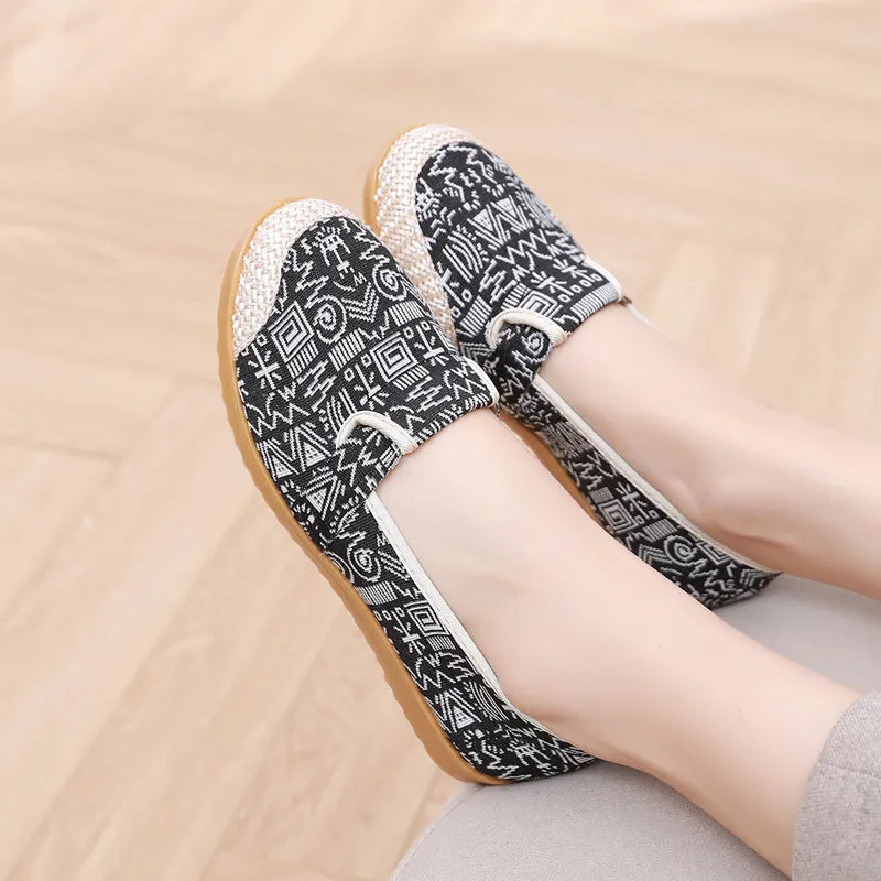 Women's ethnic style flat cloth shoes in red with colour stitching and a beef tendon sole.