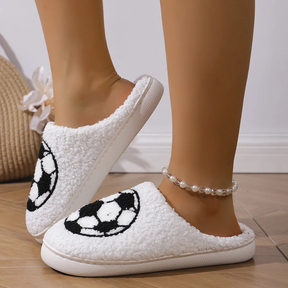 White thermal cotton slippers with ethnic totem pattern, plush upper, and TPR sole on a floor