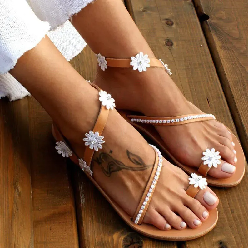 Brown floral Roman sandals for women with flat rubber sole and artificial PU upper