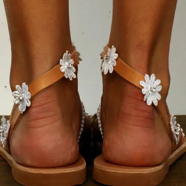 Brown floral Roman sandals for women with flat rubber sole and artificial PU upper