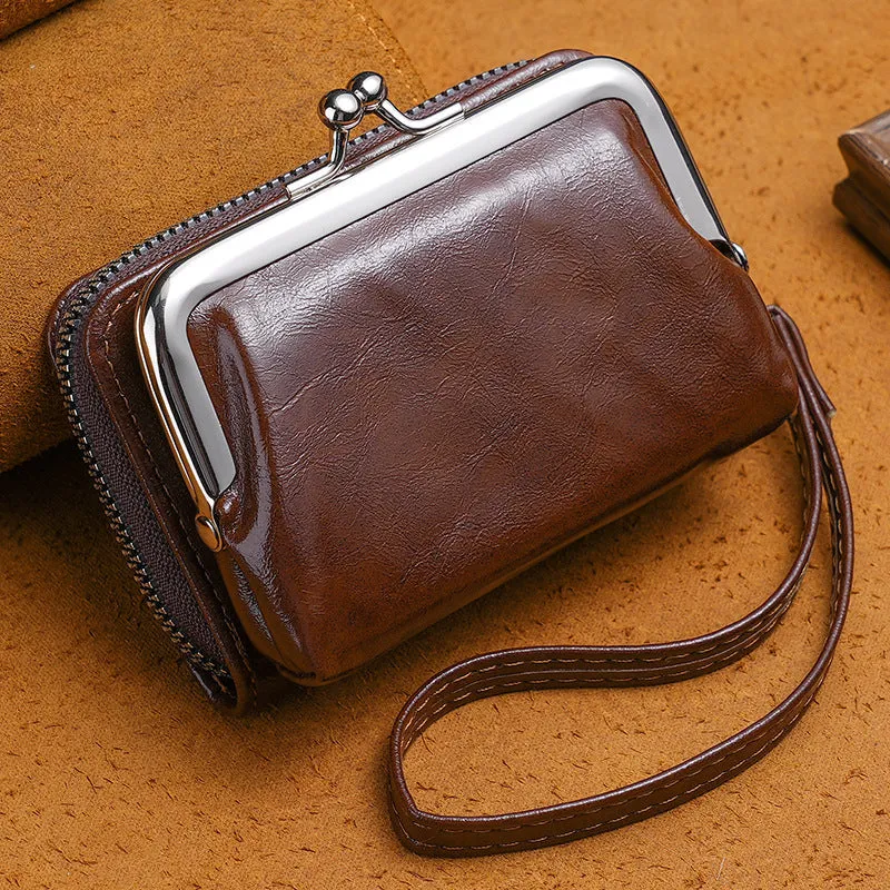 Round ladies coin purse with snap fastener and detachable metal clip, shown in assorted colours.