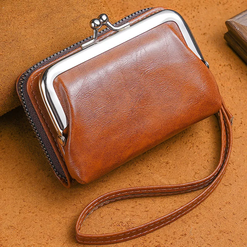 Round ladies coin purse with snap fastener and detachable metal clip, shown in assorted colours.