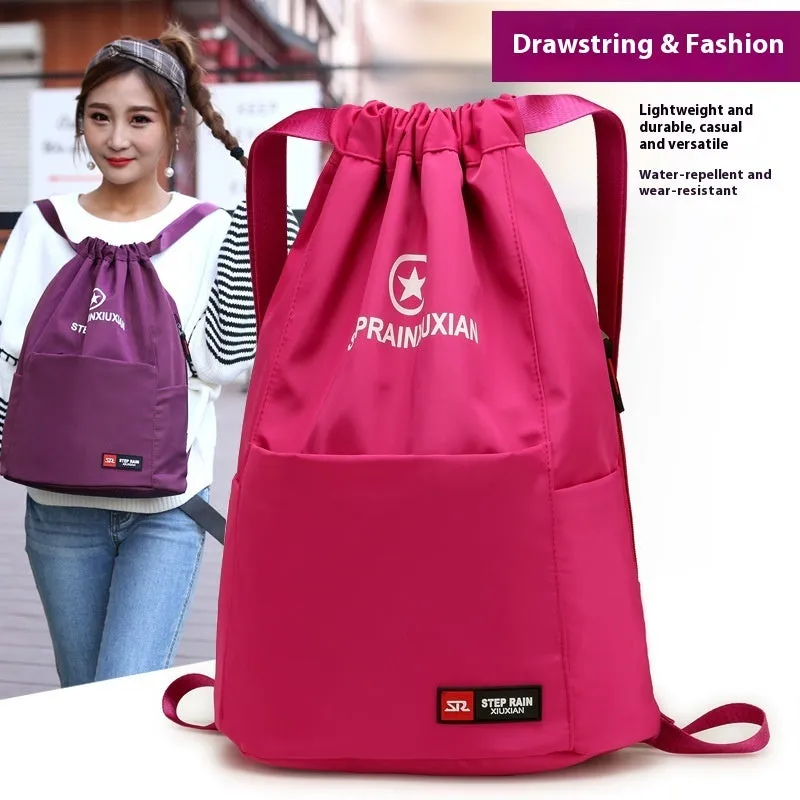 Lightweight drawstring backpack in Oxford cloth available in black, blue, pink and other colours