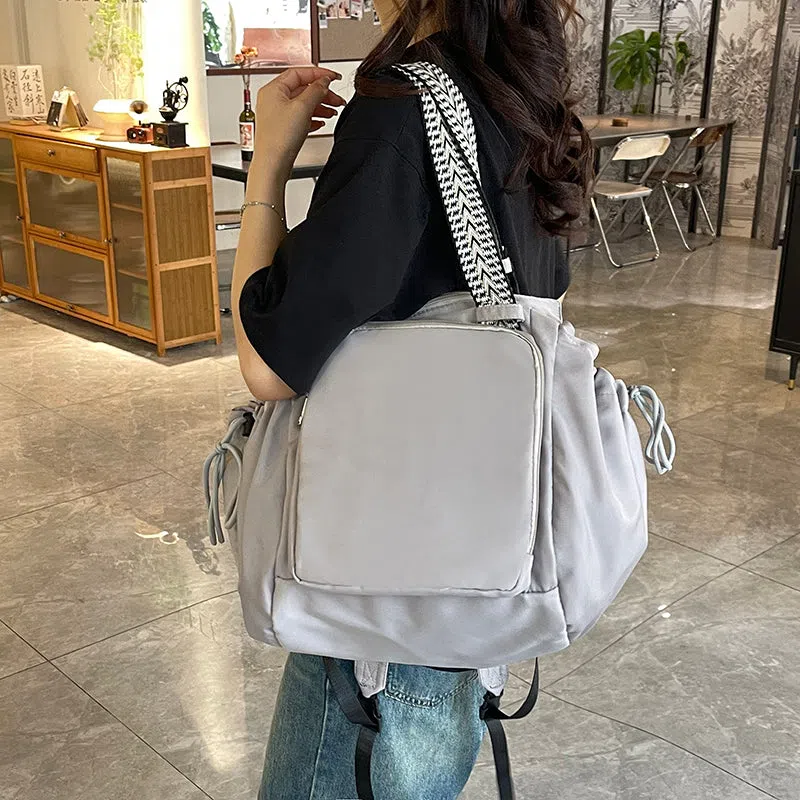 Nylon mommy bag in large capacity tote style, available in multiple colours for travel and daily use