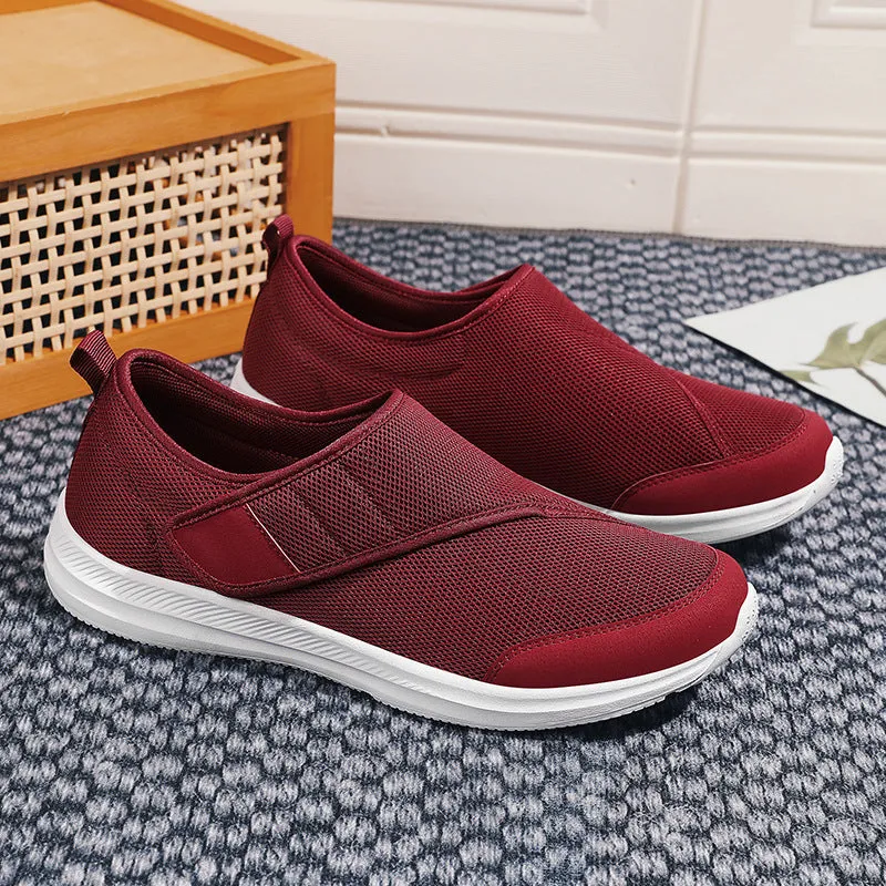 Velcro fastening walking shoes with mesh upper in black, available in sizes 36 to 47.