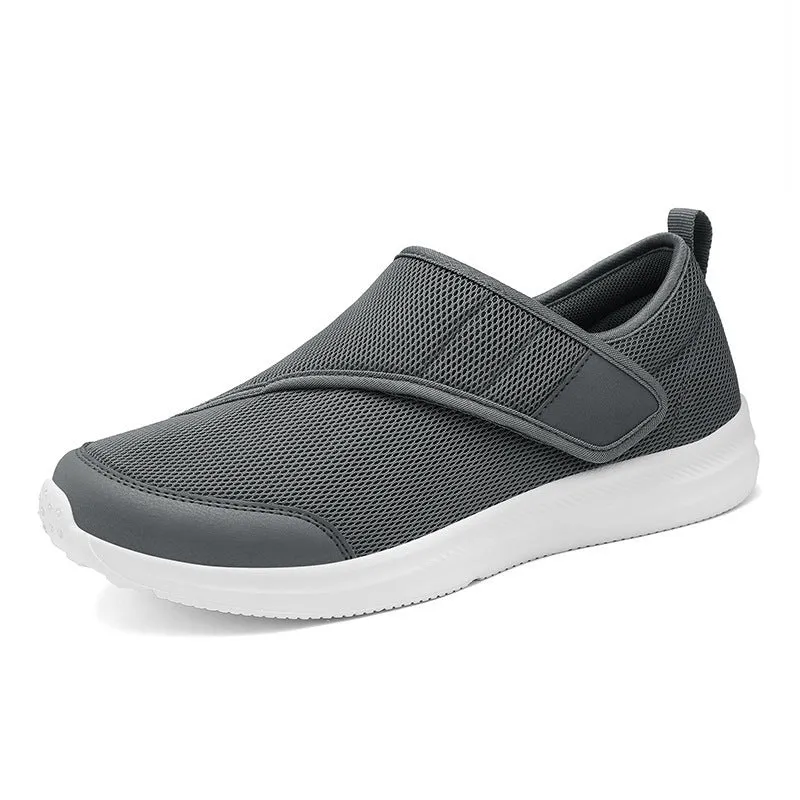 Velcro fastening walking shoes with mesh upper in black, available in sizes 36 to 47.