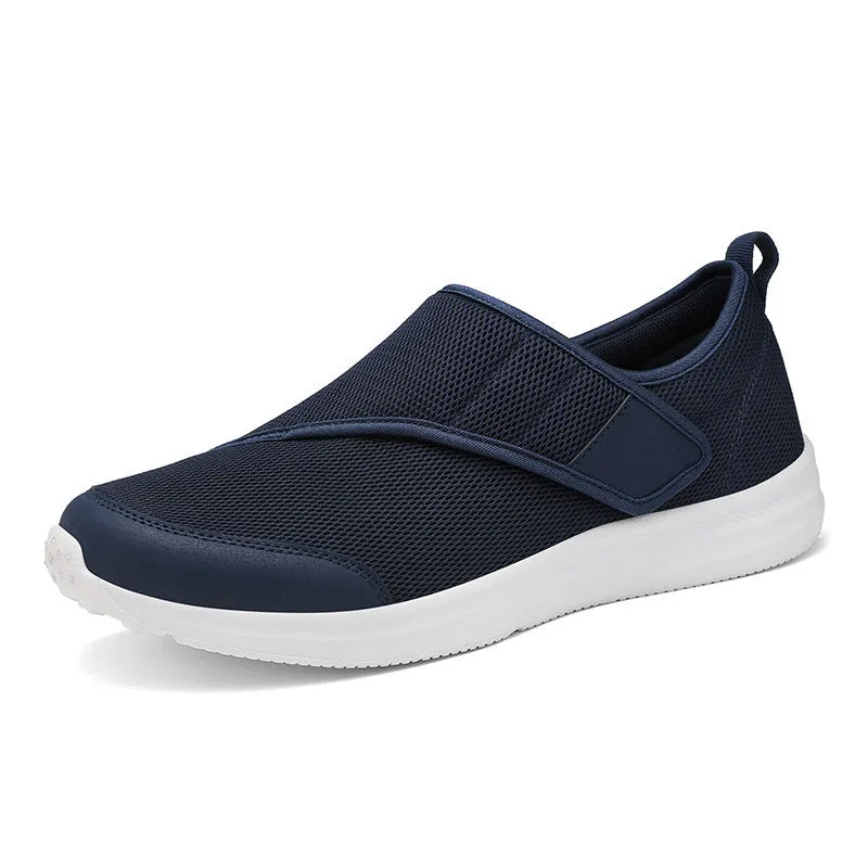 Velcro fastening walking shoes with mesh upper in black, available in sizes 36 to 47.