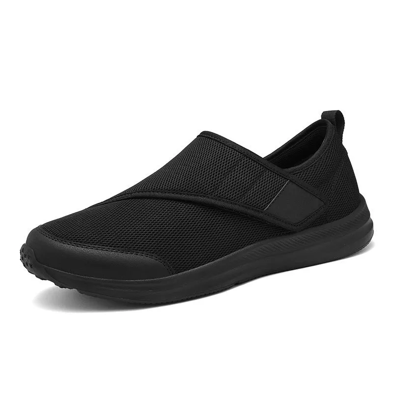 Velcro fastening walking shoes with mesh upper in black, available in sizes 36 to 47.