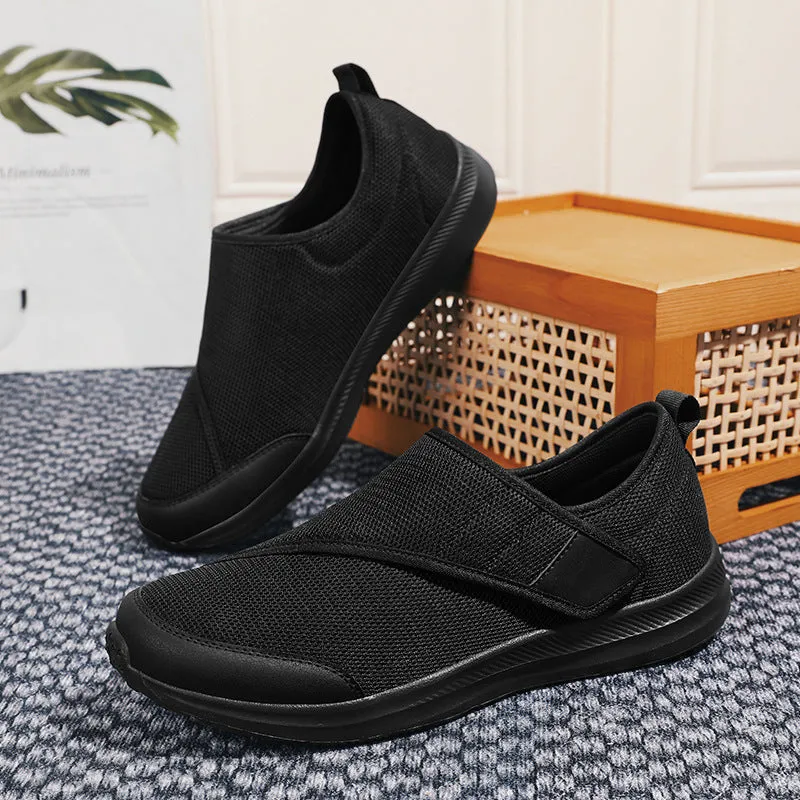 Velcro fastening walking shoes with mesh upper in black, available in sizes 36 to 47.