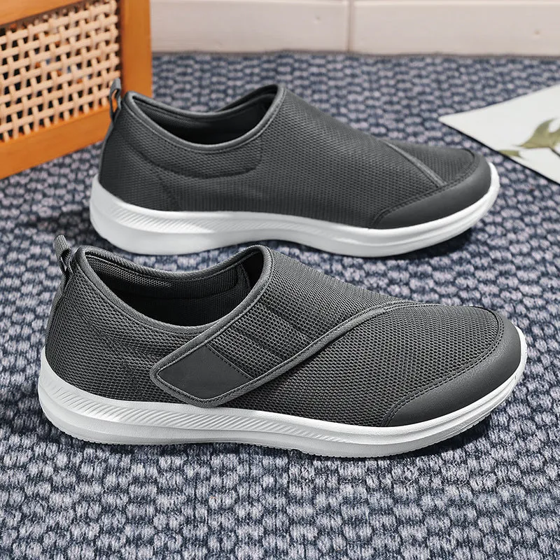 Velcro fastening walking shoes with mesh upper in black, available in sizes 36 to 47.