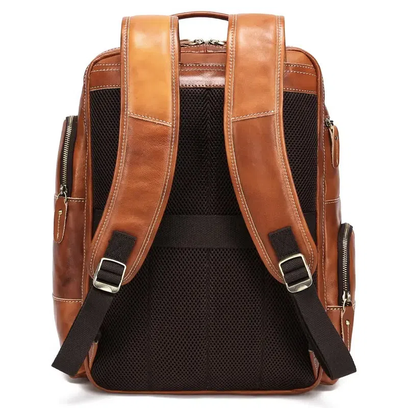 Bronze genuine leather backpack with structured design and top handle for business travel