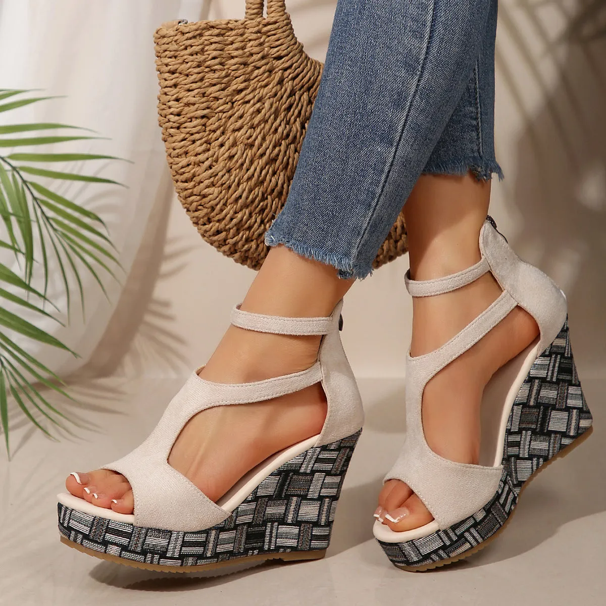 Women's cream white ankle-strap sandals with thick rubber sole, buckle closure, and cloth upper.