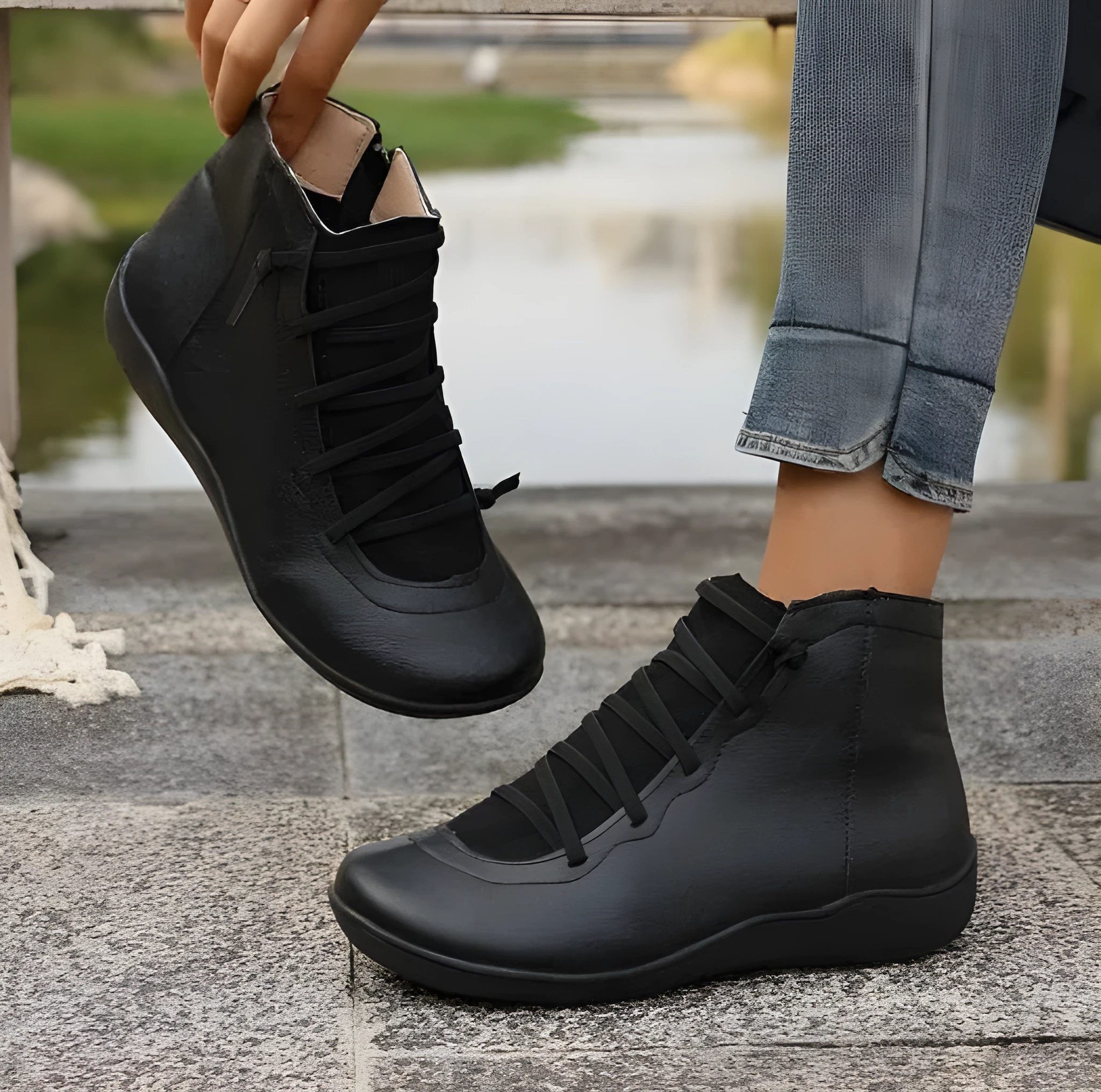 Women's plus size flat side zipper short boots in solid black with round toe and low heel