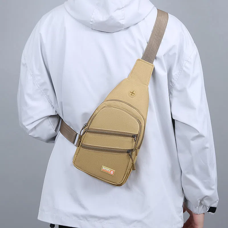 Canvas crossbody bag for men, lightweight waterproof with stitching detail, available in multiple colours