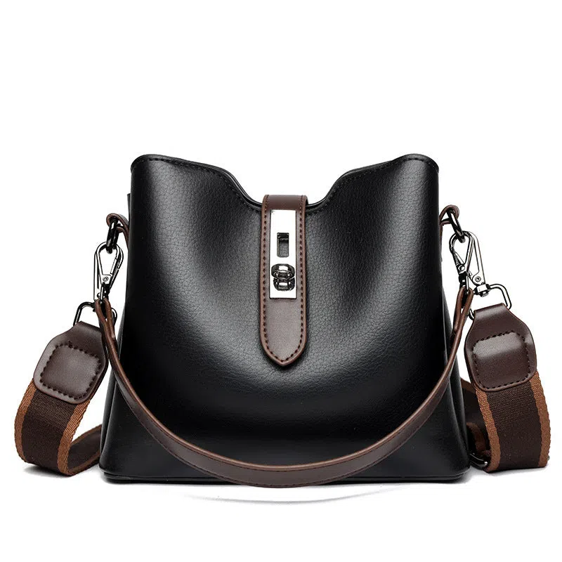 Textured PU bucket bag in black with patchwork stitching, horizontal rectangular shape, single shoulder strap.
