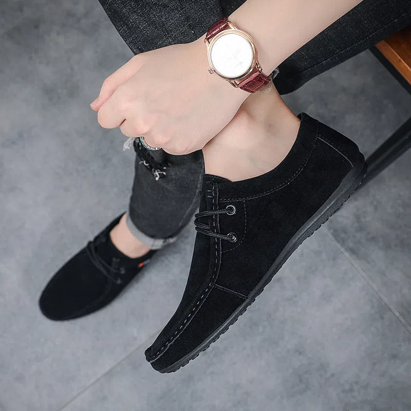 Men's black slip-on loafers with soft sole, round toe, and stitching detail on a neutral background